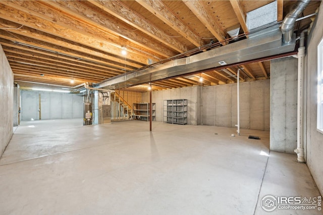 unfinished below grade area with water heater and stairs