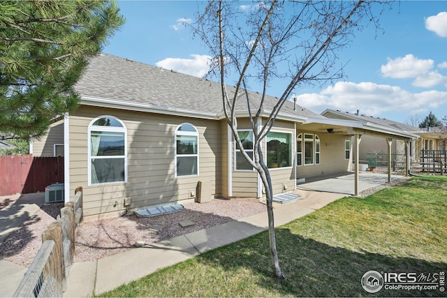 back of house with ceiling fan, central AC, a lawn, a patio area, and fence
