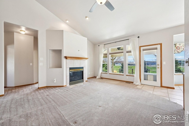 unfurnished living room featuring baseboards, carpet, and plenty of natural light