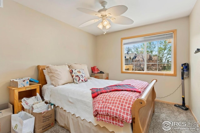 bedroom featuring visible vents, baseboards, ceiling fan, and carpet