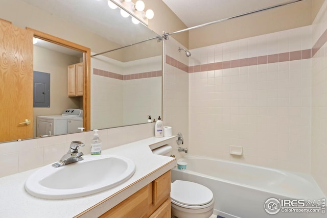 full bathroom featuring electric panel, toilet, shower / bathing tub combination, vanity, and washing machine and dryer