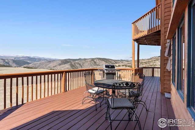 9 Mummy View Ct, Livermore, CO 80536 - wooden deck featuring a mountain view, outdoor dining space, and area for grilling