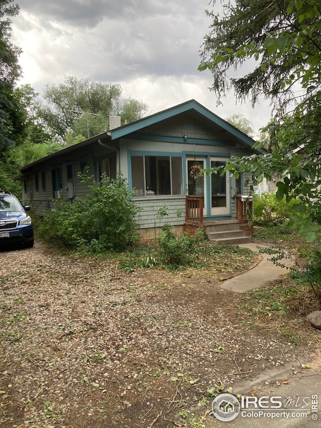 view of front of home with a chimney