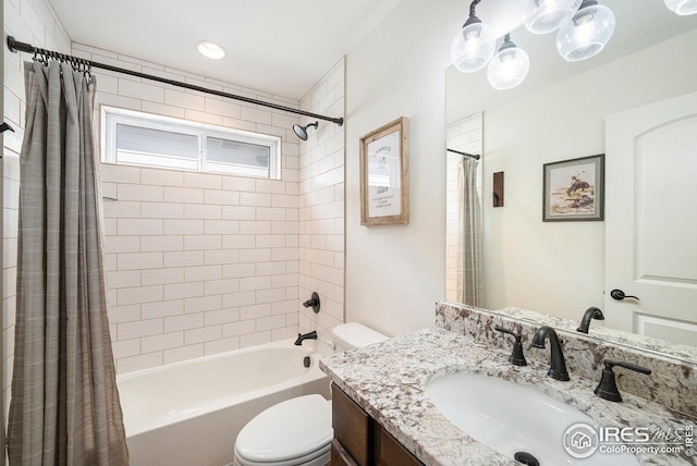 full bathroom with vanity, toilet, and shower / bath combo