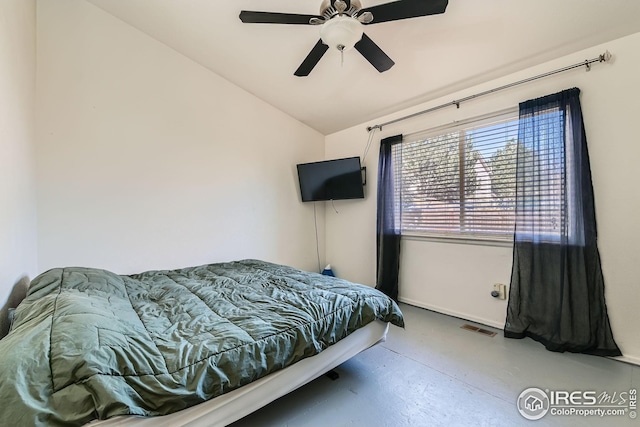 bedroom with ceiling fan, vaulted ceiling, visible vents, and baseboards