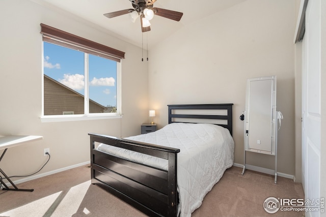 bedroom featuring carpet floors, lofted ceiling, and baseboards