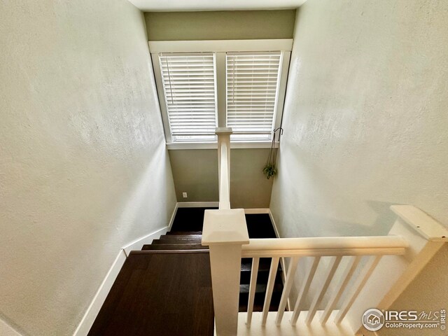 506 E 1st Ave, Otis, CO 80743 - stairway featuring a textured wall and baseboards