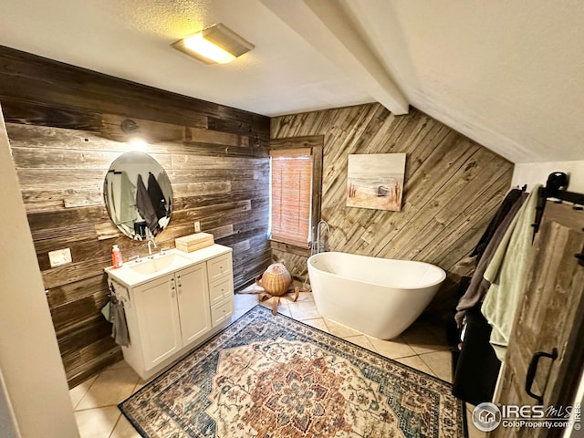 506 E 1st Ave, Otis, CO 80743 - full bath with tile patterned floors, wooden walls, vanity, and a freestanding bath