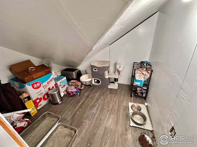 506 E 1st Ave, Otis, CO 80743 - game room featuring vaulted ceiling and wood finished floors