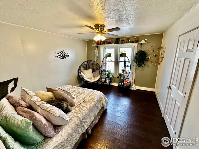 506 E 1st Ave, Otis, CO 80743 - bedroom with baseboards, a ceiling fan, wood finished floors, and a textured ceiling