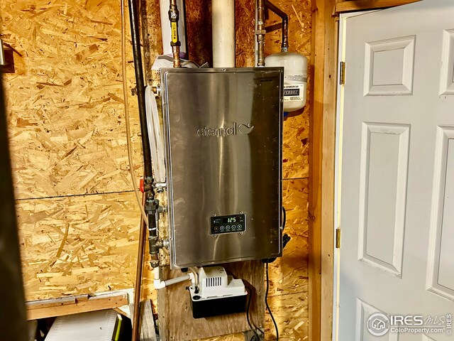 506 E 1st Ave, Otis, CO 80743 - utility room with water heater