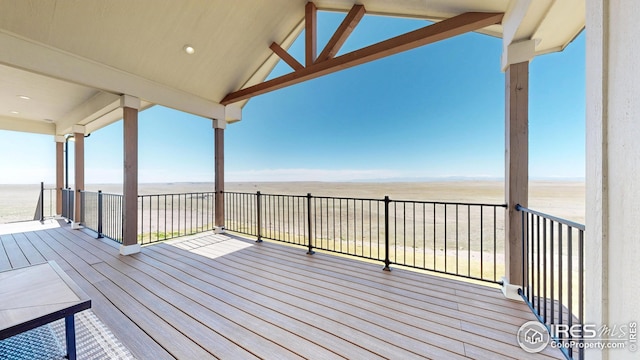 wooden deck with a water view