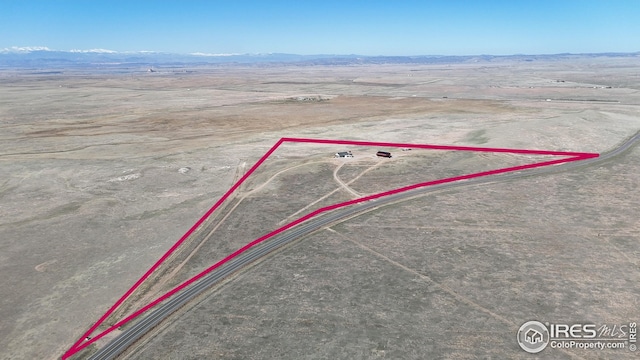 aerial view with a rural view, a desert view, and a mountain view