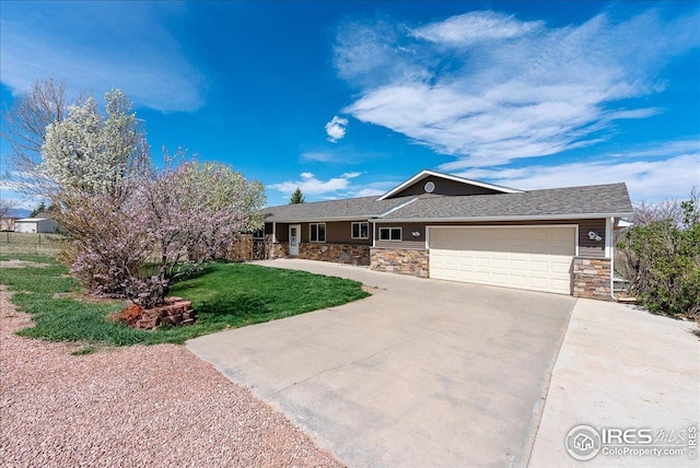ranch-style house with an attached garage, stone siding, and concrete driveway