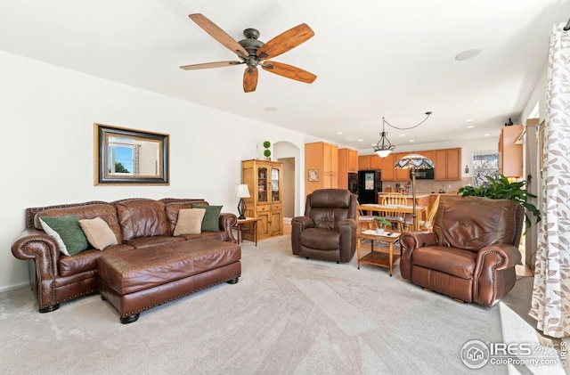 living room featuring a ceiling fan, recessed lighting, and light colored carpet