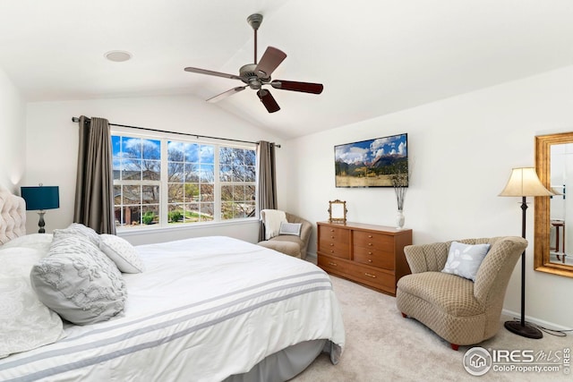 bedroom featuring ceiling fan, vaulted ceiling, and carpet flooring