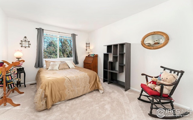 carpeted bedroom with visible vents and baseboards
