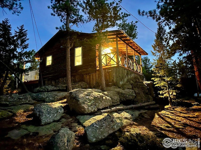 view of property exterior featuring log siding