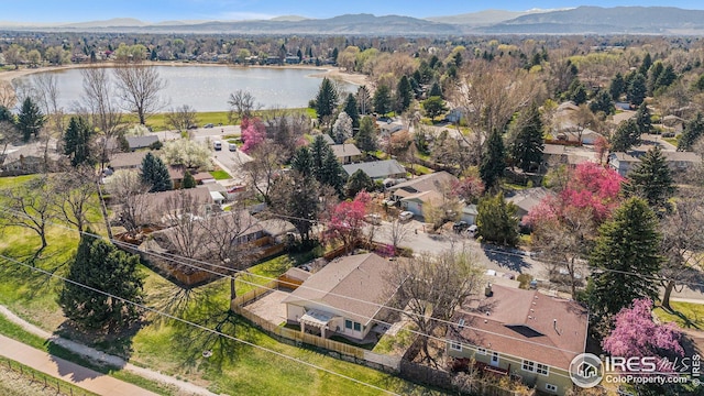 birds eye view of property with a residential view and a water and mountain view