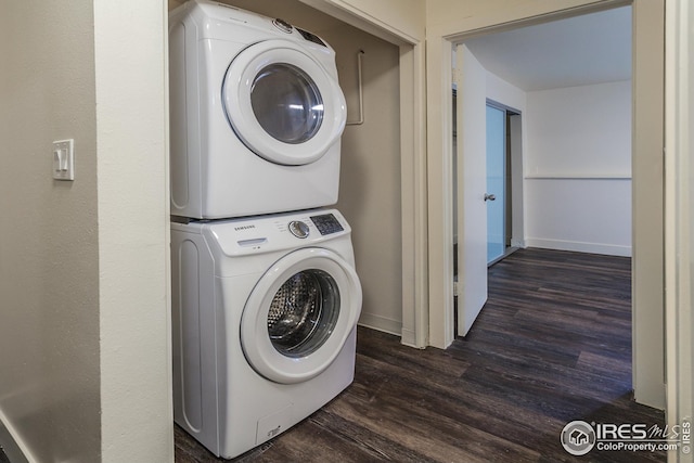 1733 Azalea Dr Unit 2, Fort Collins, CO 80526 - clothes washing area featuring dark wood finished floors, baseboards, stacked washer / dryer, and laundry area