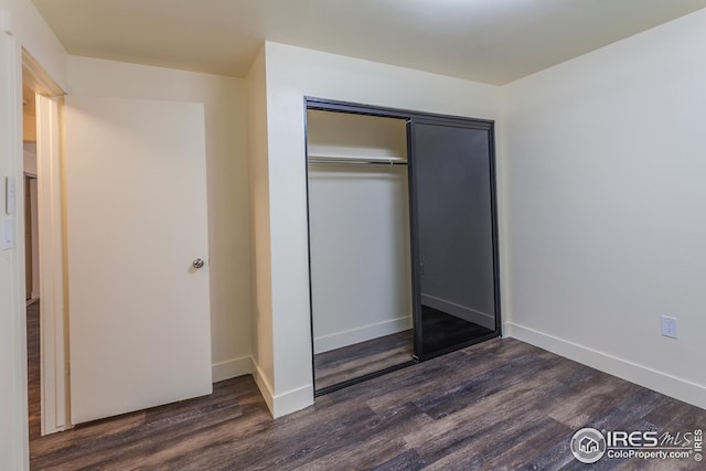 1733 Azalea Dr Unit 2, Fort Collins, CO 80526 - unfurnished bedroom with baseboards, wood finished floors, and a closet