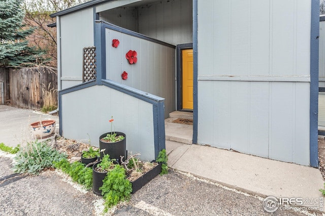 1733 Azalea Dr Unit 2, Fort Collins, CO 80526 - view of exterior entry featuring fence