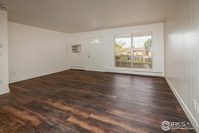 1733 Azalea Dr Unit 2, Fort Collins, CO 80526 - spare room with a baseboard heating unit, dark wood finished floors, baseboards, and a wall mounted AC