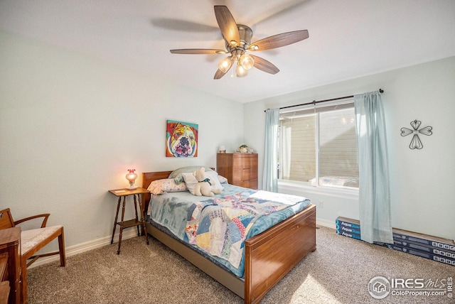 carpeted bedroom featuring a ceiling fan and baseboards