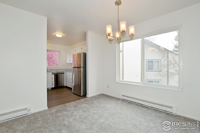 unfurnished dining area featuring baseboards, dark carpet, a chandelier, and a baseboard radiator