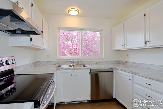 kitchen featuring white cabinets, extractor fan, stainless steel appliances, and a sink
