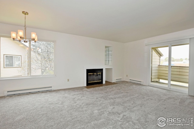unfurnished living room with a fireplace with flush hearth, a baseboard radiator, a chandelier, and carpet