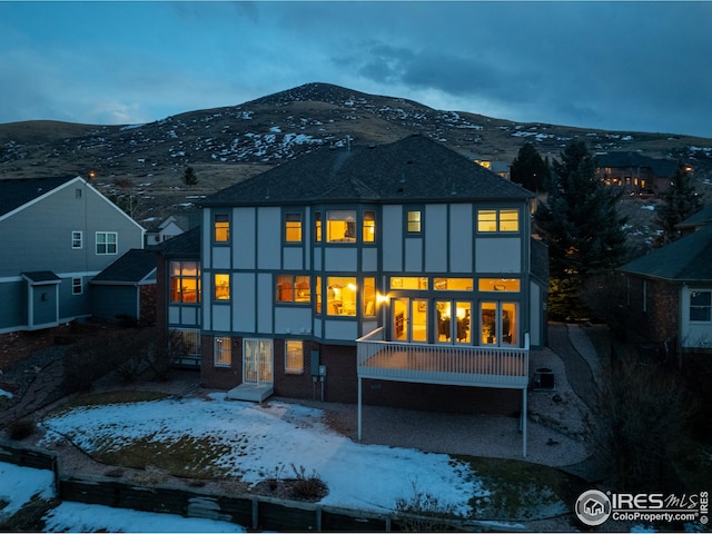 16261 W Ellsworth Ave, Golden, CO 80401 - snow covered house with stucco siding and a mountain view