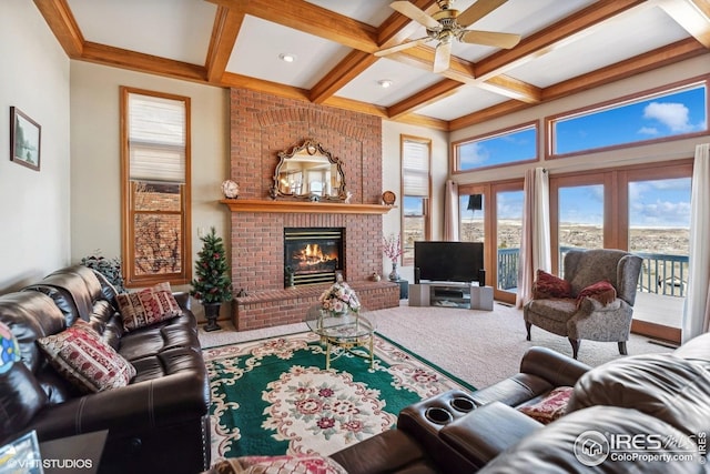 16261 W Ellsworth Ave, Golden, CO 80401 - carpeted living room with coffered ceiling, beamed ceiling, ceiling fan, a brick fireplace, and french doors