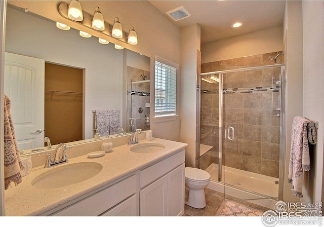full bath featuring a sink and a shower stall