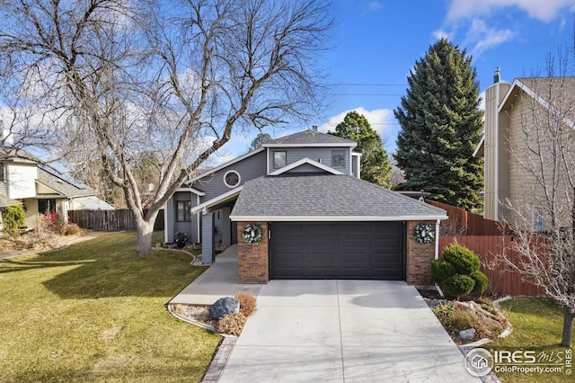 traditional home with fence, a shingled roof, concrete driveway, an attached garage, and brick siding