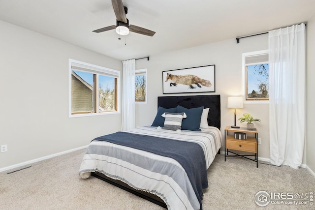 bedroom featuring baseboards, visible vents, and carpet floors