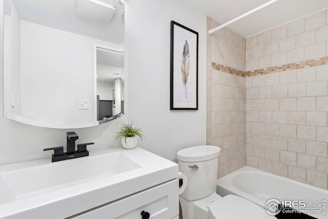 full bath with toilet, vanity, and tub / shower combination