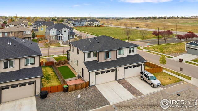 drone / aerial view with a mountain view and a residential view