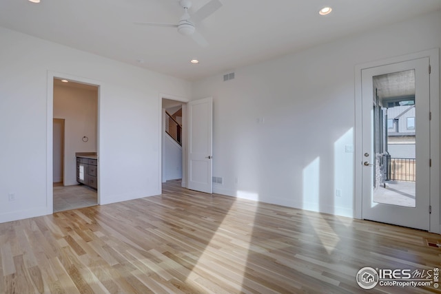 unfurnished room with visible vents, a ceiling fan, light wood-style floors, and recessed lighting