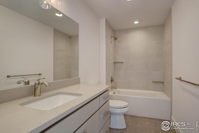 bathroom featuring recessed lighting, tile patterned floors, toilet, shower / bathtub combination, and vanity