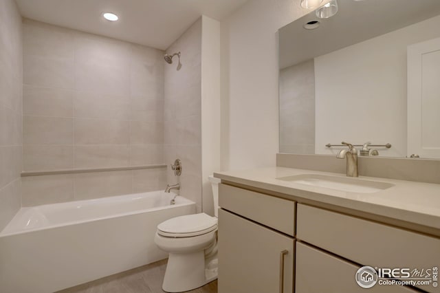 full bathroom featuring recessed lighting, toilet, vanity, and shower / bathing tub combination
