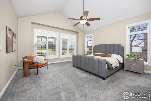 carpeted bedroom featuring lofted ceiling, a ceiling fan, baseboards, and multiple windows