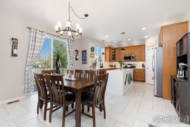 dining area with visible vents, recessed lighting, and a chandelier