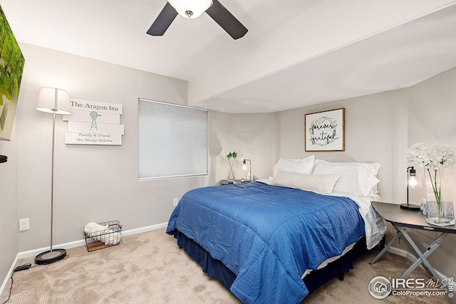 carpeted bedroom with a ceiling fan and baseboards