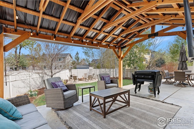 view of patio / terrace with a fenced backyard, outdoor lounge area, and outdoor dining space