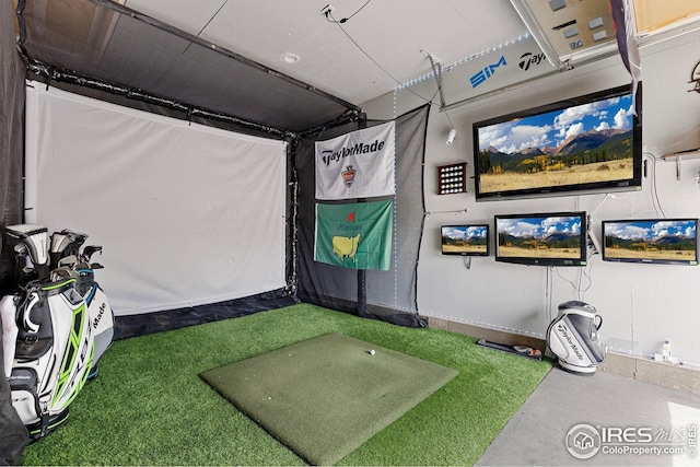 game room with golf simulator