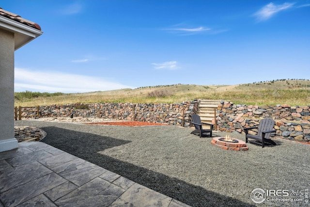 view of yard with a fire pit