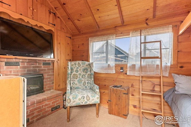 living area with wooden ceiling, a fireplace, lofted ceiling, wooden walls, and carpet floors