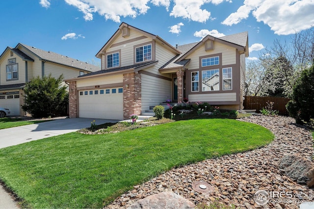 craftsman inspired home with fence, a front lawn, concrete driveway, brick siding, and a garage