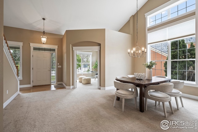 3122 Notabon Ct, Lafayette, CO 80026 - carpeted dining area featuring healthy amount of natural light and a chandelier